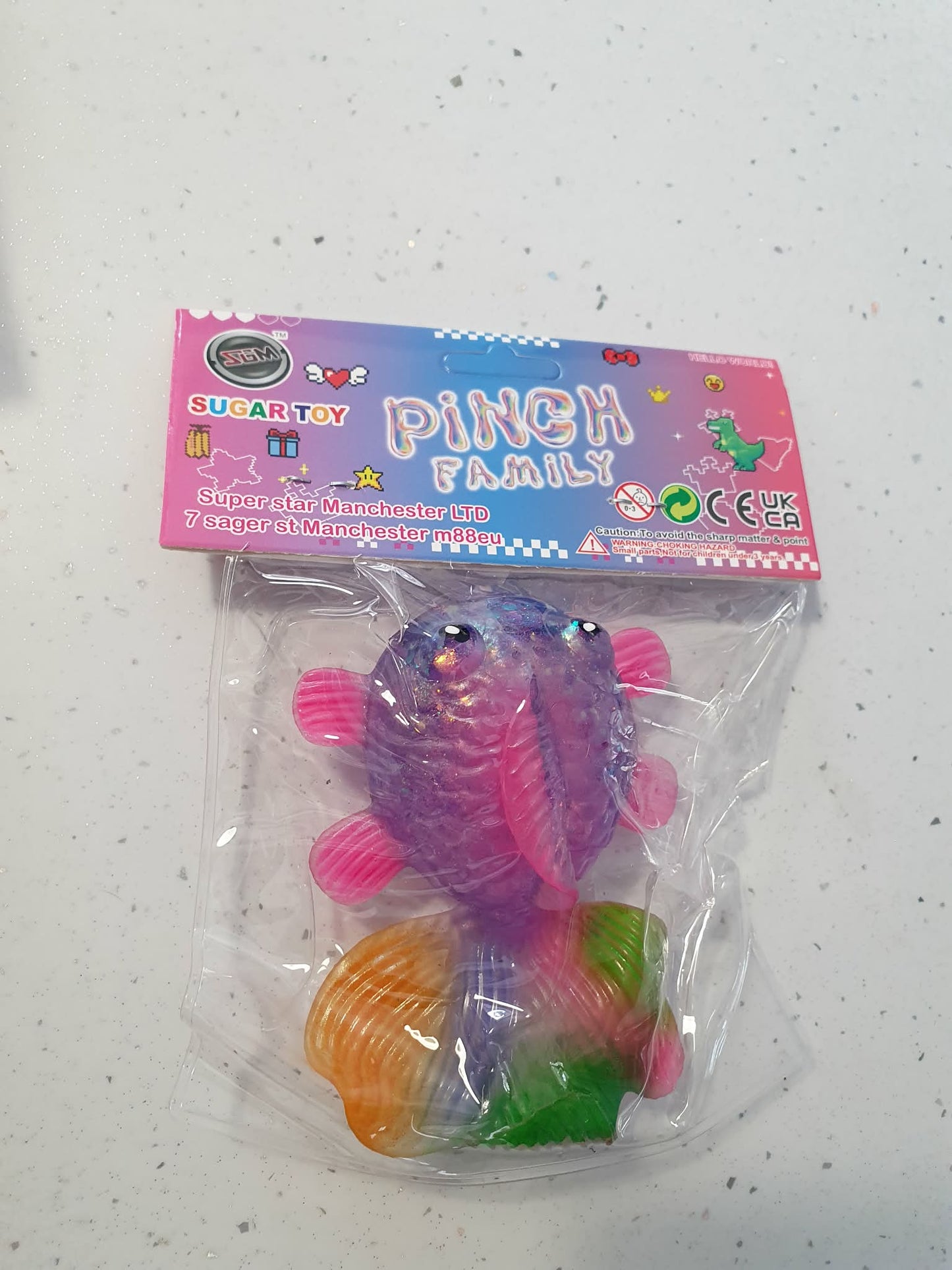 squishy stretch glitter fish with rainbow tail