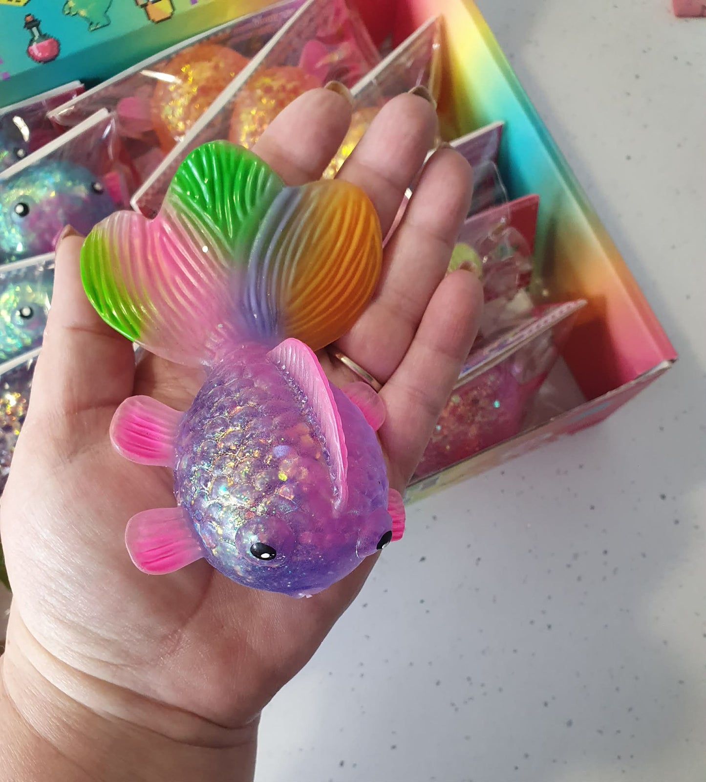 squishy stretch glitter fish with rainbow tail