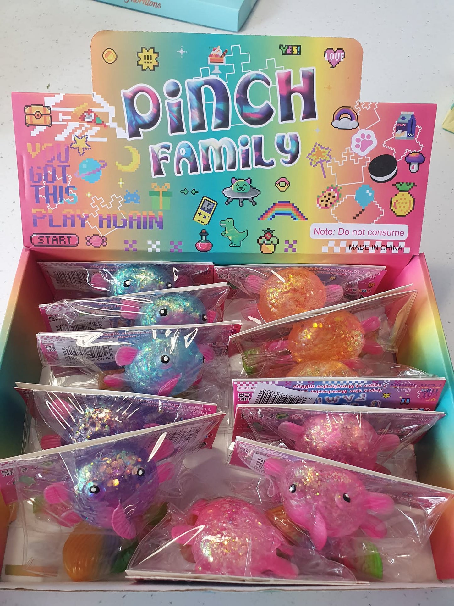 squishy stretch glitter fish with rainbow tail